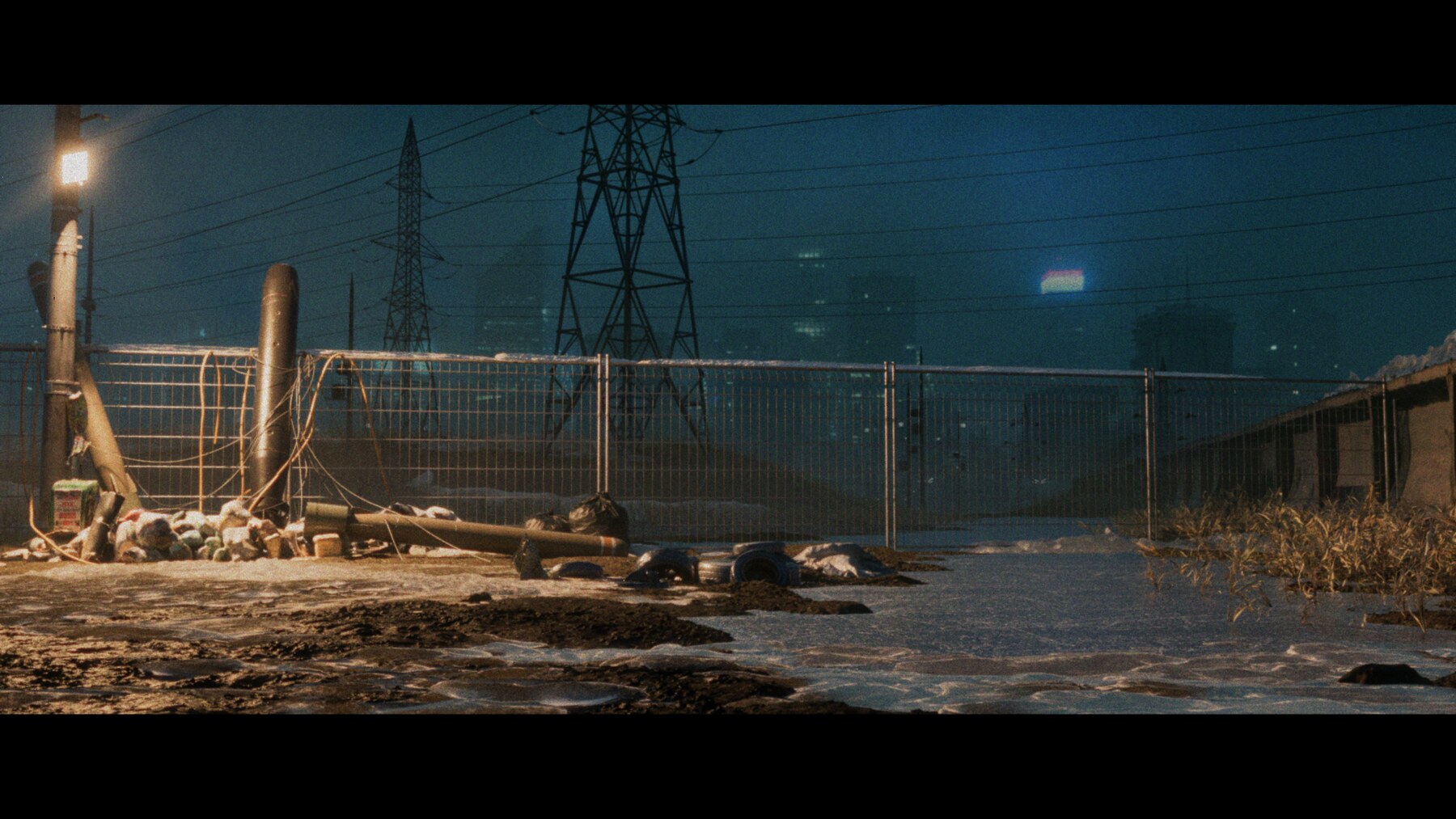 Fence and power lines at night